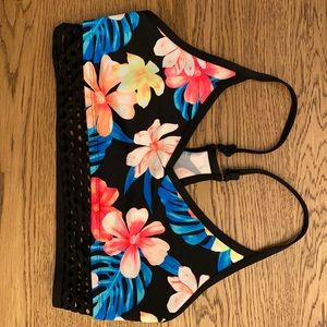 Medium, lightly worn. Tag is cut out